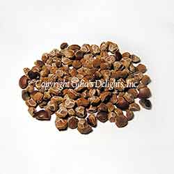 Pile of roasted corn nuts on a white background.