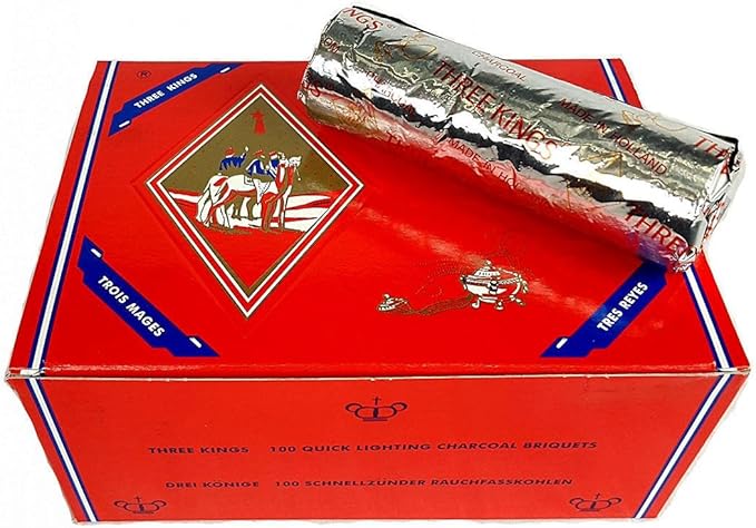 Three Kings - charcoal - Shaman's Garden Red Three Kings box of 100 quick-lighting charcoal briquets with a foil-wrapped roll resting on top.